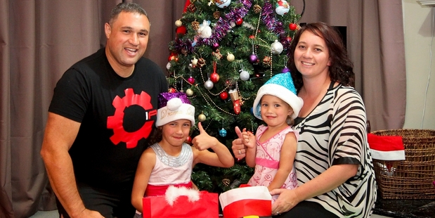FESTIVE FAMILY: Looking forward to Christmas are Henry Heke, Keita Heke 6, Mahinaarangi Heke 2, and Monique Heke, at home in Flaxmere. PHOTO/GLENN TAYLOR HBT134386-01.