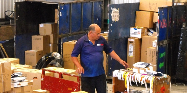 Geoff Potaka sorts out his load before taking to the road. He does the Fastway Couriers run from Wanganui to Marton and into South Taranaki. Photo/John Maslin