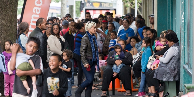 Every day families queue at the Auckland City Mission for food and presents for the children. Photo / Greg Bowker