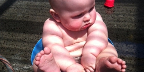 Hurry with my paddling pool Santa! This bowl is kinda tight. (Pictured: Boh Light, 7 months old)