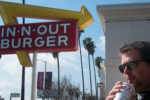 A man enjoying In-N-Out Burger's wares in Los Angeles. Photo / Janie Smith