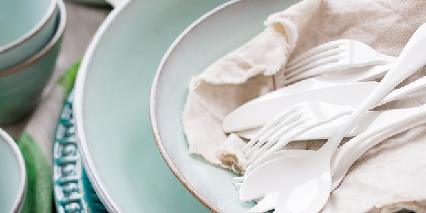 White board, white enamel serving spoons, knife, fork and teaspoon,
Kinto bowls, side plates and cups all from Nest. Tablecloth, turquoise platter from Republic Home. Photo / Babiche Martens.