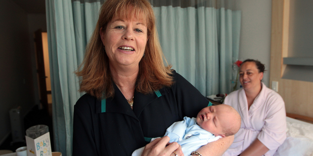 Angela Wilson at Birthcare with baby Michael, 2 days old, and mother Pekina Semu. Photo / Doug Sherring