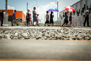 Those taking part in the blessing walk across the Walters Road crossing. Photo / Michael Craig