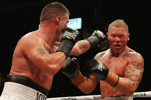 Brian Minto (left) of the USA fights Shane Cameron during the Fight for Life. Photo / Getty Images