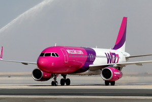 The woman went into labour just as the Wizz Air jet came in for landing, giving birth just after it touched down. Photo / AP