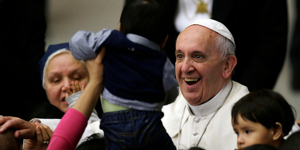 Pope Francis smiles as he meets children at the Vatican. Photo / AP