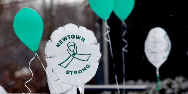 Balloons fly on the first anniversary of the Sandy Hook massacre, in Newtown, Connecticut. Photo / AP