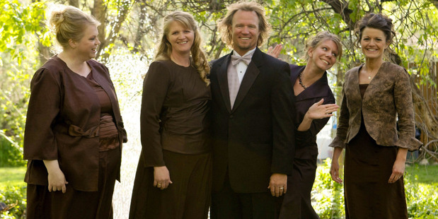 Kody Brown, centre, poses with his wives, from left, Janelle, Christine, Meri, and Robyn in a promotional photo for TLC's reality TV show. Photo / AP