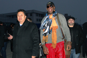 Dennis Rodman walks with Vice Minister of North Korea's Sports Ministry, Son Kwang Ho. Photo / AP