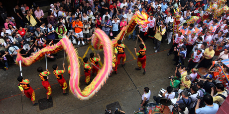 Spectators watch a traditional dance.
