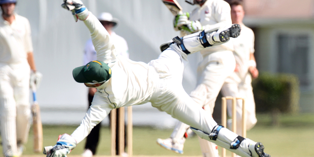 Stags wicketkeeper Kruger van Wyk dives anxiously for a ball on the last day of the Plunket Shield match against Auckland yesterday. Photo/Duncan Brown.
