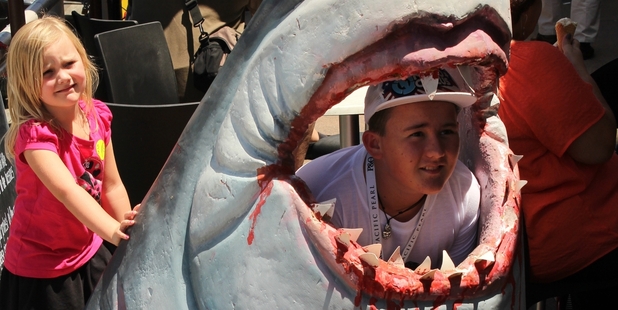 Freddie the Shark devours another young visitor to Paihia. Photo / Peter de Graaf