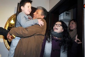Turkish journalist Mustafa Balbay (C) poses with members of his family after being released from 5 years in prison. Photo / AFP