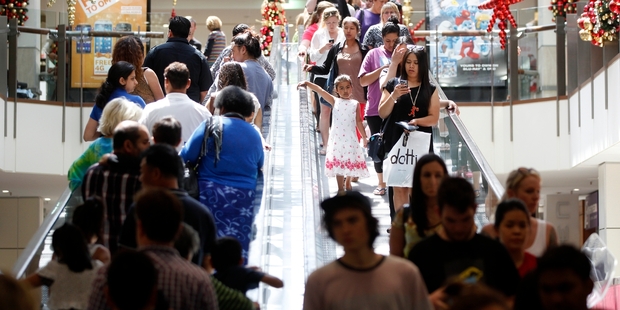 Christmas shoppers crowd the escalators at Westfield St Lukes yesterday. Photo / Chris Gorman