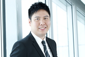 Brian Tsoi is happy to stand at the departure gate saying "Thank you for choosing Cathay Pacific''.
