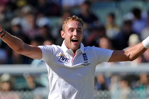 England's Stuart Broad celebrates taking the wicket of Australia's Ryan Harris for six runs.Photo / AP