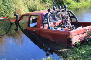 Liam Robinson and Angus Bailey plunged into the Halswell River to pull a man from the cab of his submerged truck. Photo / APN