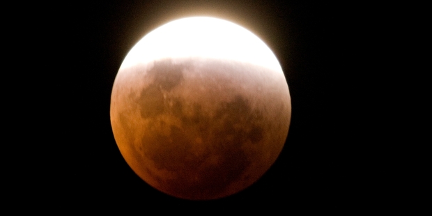 The lunar eclipse will be quite eerie with the moon looking like a dim red disc, says an expert. Photo / Mark Mitchell