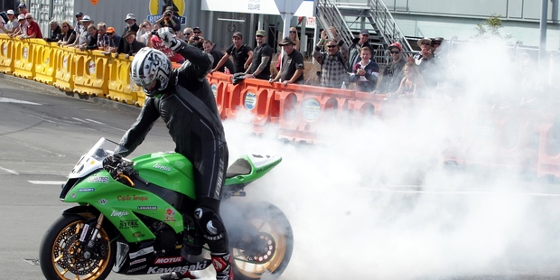Hamilton's Nick Cole celebrated his unbeaten run on the Cemetery Circuit with a burnout for the crowd. Photo/Stuart Munro