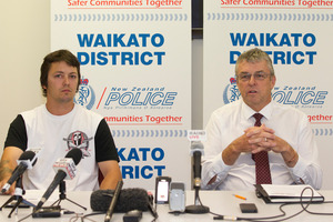 Matthew Bloxham, Son in law and family spokesman for the Cochrane family speaks at a press conference at the Hamilton Police Station alongside Detective Senior Sergeant Mark Greene. Photo / NZ Herald