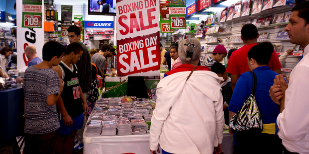Kiwis flocked to the shops yesterday for the annual Boxing Day sales - but many are increasingly buying cheaper online from overseas. Photo / Dean Purcell