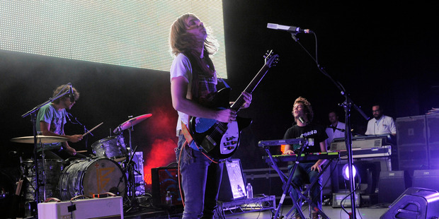 Kevin Parker, center, and his band Tame Impala. Photo / AP