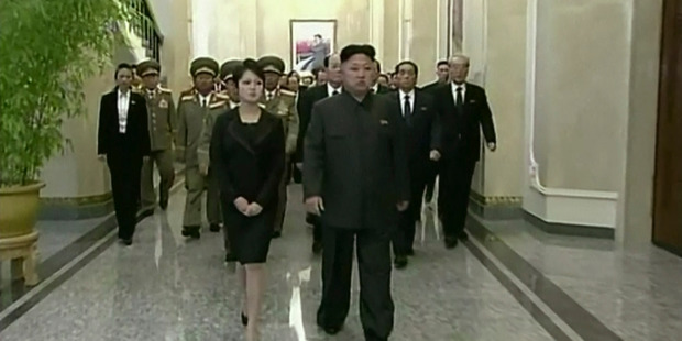 North Korean leader Kim Jong Un, center right, his wife, Ri Sol Ju, center left, and high ranking officials. Photo / AP