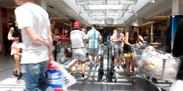Christmas shoppers flocked to Westfield St Lukes yesterday. Photo / Chris Gorman
