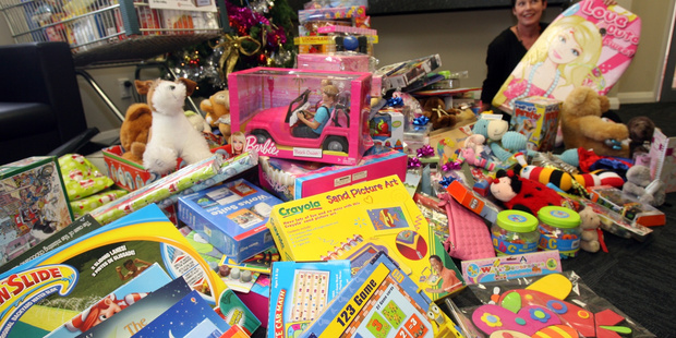 wta191213lfpresents05.jpg Wairarapa Times-Age advertising manager Bex Johnson with the donated Christmas presents for the Salvation Army.