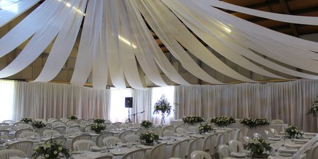 Volunteers pitched in and reconfigured the ceiling decoration in the wake of the discovery that $5000 worth of decorative silks were missing. Photo/Supplied.