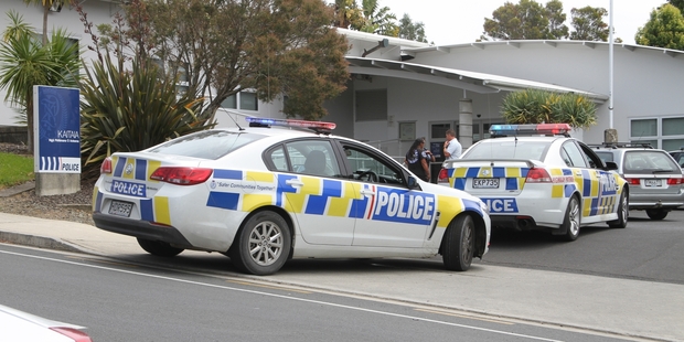 ALTERCATION: Detective Mark Dalziel speaking to people allegedly involved in an altercation at the Kaitaia Police Station.
