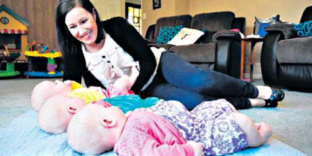 IN A ROW: Melanie Lewis has been enjoying the time with her three new baby girls.