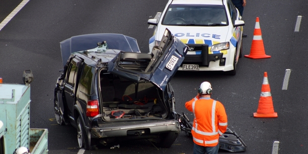 One person was seriously hurt when this vehicle rolled on the motorway to Auckland Airport. Photo / SNPA