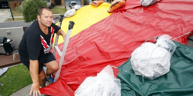 TWISTER'S TALE: Warren Bester's heavily tarpaulined roof was testament to the power of a mini tornado that hit Papamoa East yesterday.PHOTO/GEORGE NOVAK