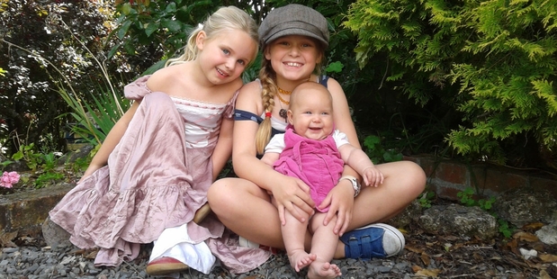 It was a lucky escape for 4-month-old Lotta Peachey, with her sisters Stella, 8 (holding Lotta) and Lina, 5.