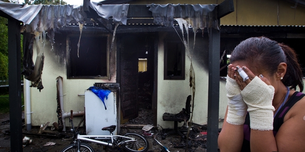 BLACK MONDAY: A Ngongotaha mother suffered burns to her hands as she rescued her five young children from their burning house. PHOTO/STEPHEN PARKER