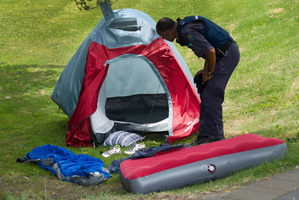 Police at the scene of the serious assault. Photo / Alan Gibson