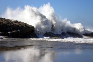 SURGING SEA: A woman was lucky to escape with only moderate injuries after being knocked off Castlepoint reef by a wave on Saturday.PHOTO/ROSANNE HAYES
