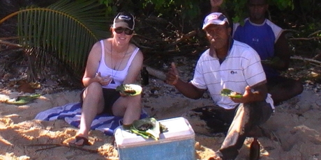 Mrs Austrin on holiday in Fiji eating the fish she believes made her so ill.