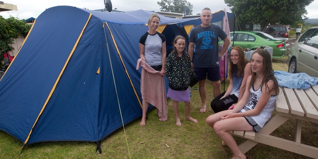 The soaked Norris family, from left, Joanna, Kate, 10, Scott, Amy and Hannah, both 14. Photo / Christine Cornege