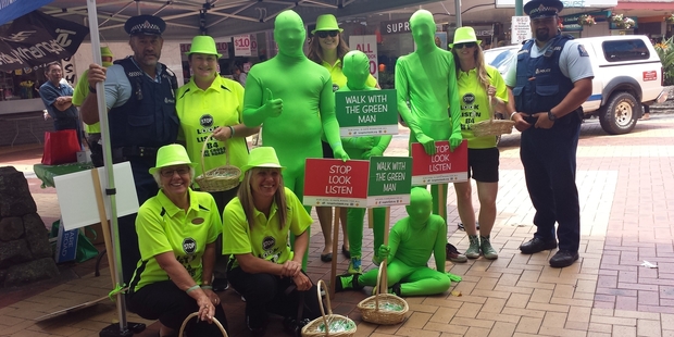 GREEN MEANS GO - CAREFULLY: Getting the festive road safety message through to Whangarei shoppers recently were: front row, Gillian Archer (left), Rachel Woodworth, Noah Worth; back row, Constable Pete Thomas, Marnie Worth, Billy Woodworth, Claire Woodward, Hunter Worth, Mikey Gillard, Hannah Mitchell and Constable Solomone (Soli) Halaapiapi.