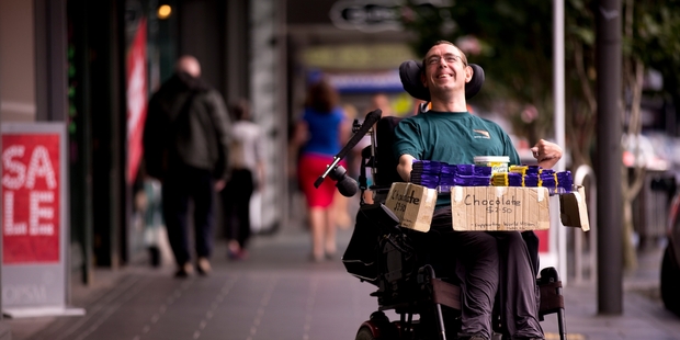 Mark Grantham has been selling chocolate for charity from his wheelchair for more than 20 years. Photo / Dean Purcell