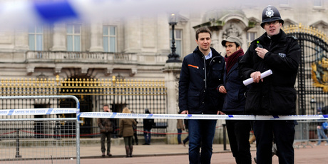 A cornered off area containing knives, a hat and Taser wire outside Buckingham Palace in central London. Photo / AP