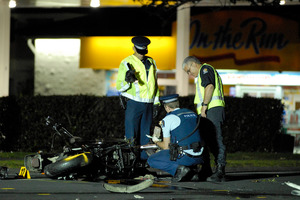 Police investigate the motorbike crash. Photo / Herald on Sunday