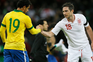 England's Frank Lampard, right shakes hands with Brazil's Fred, at the end match during following their international soccer game at Wembley stadium in London. Photo / AP