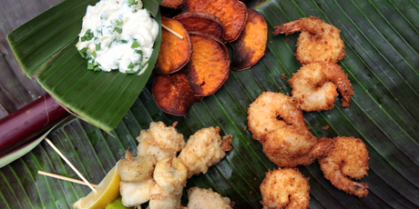 Sweet potato chips with coconut prawns, fish and banana kebabs. Photo / Doug Sherring