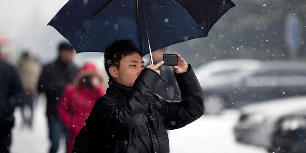 There are a staggering one billion mobile phone subscribers in China. Photo / AP
