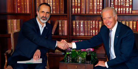 US Vice President Joe Biden, right, and Sheikh Moaz al-Khatib, Syria's top opposition leader, shake hands at the Security Conference in Munich, southern Germany. Photo / AP