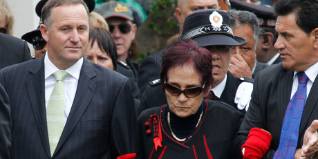 Prime Minister John Key is lead onto the marae by Titewhai Harawira in 2012. Photo / Natalie Slade